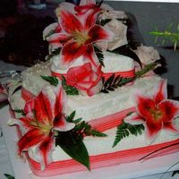 Stargazer Lillies Fresh flowers, and ribbon with bc icing.