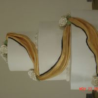 Black And Gold Wedding Cake This is my first wedding cake! I did this cake for a couple who are huge Purdue fans. Their wedding reception was black and gold. It is...