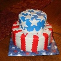 4Th Of July Top layer yellow and bottom is chocolate frosted in BC with Fondant Accents. Hubby requested a flag cake, and this is what I decided on. He...