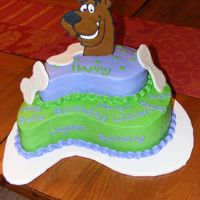 Scooby Doo Chocolate cake and top layer is Yellow cake all frosted in BC. The scooby and bones are RI.