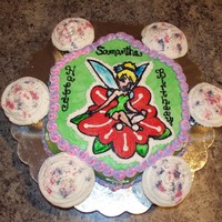 Tinkerbell Flower Cake Tinkerbell buttercream transfer done on Wilton Daisy Cake Mold...Chocolate.Cupcakes sprinkled with "fairy dust"