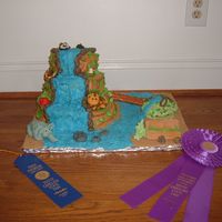 State Fair Rainforest Cake Here is a cake i did for the state fair. The animals are all made out of fondant.