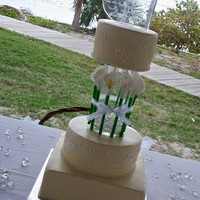 Glass Vase Wedding gumpaste calla lillies surrounding the glass vase that isi suspending the top tier. 6", 8" round and 10"square, champagne...