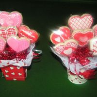 Valentine Cookie Bouquets Cookie bouquet consisting of sugar cookies decorated with royal icing. Some have sugar sparkles on them.