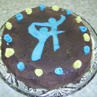 Cake Whith Gymnastics Logo Made this cake for a summer- party to a gymnastics club. The logo is placed in the middle and marzipan flowers in the clup-colours around...