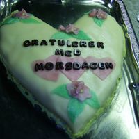 Morsdagskake_06.jpg Marzipancake cutted out on free hand. I made it for Mothers day, but it was also a birthday cake for my dad since he had his birthday at...