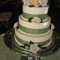 Sweet And Simple :D So I decided to make my OWN wedding cake. After doing so many for other people, it was finally my turn. And boy, I would never do that...