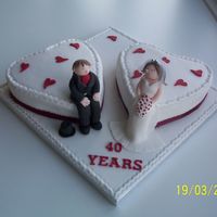 Ruby Anniversary this is two vanilla sponge hearts with a bride and groom.