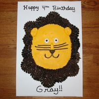 Lion Face Cupcake Cake This is a cupcake cake made into the shape of a lion. I was asked to make a lion but not a scary one, more like a fun cartoon kinda lion....