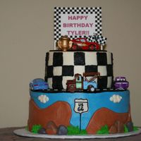 Cars Cake This cake is not my design. I found several like this on CC! Its mostly buttercream, except for the road, hills and rocks. It was my first...