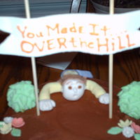 Over The Hill Butter cream with fondant figure and flowers