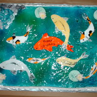 Koi Pond Got the idea from some other cake on here. Fondant fish,flowers,rocks and leaves. piping gel for water.. This is the 1st time I'm...