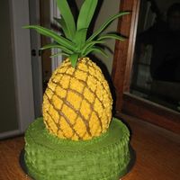 Pineapple_3.jpg My aunt loves pineapples. I made her this cake for her birthday. It's WASC frosted with buttercream and topped with gumpaste leaves....