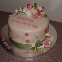 Birthday Cake 3 Layer Pina Colada cake w/ pina colada bc. Gumpaste flowers and grosgrain ribbon .