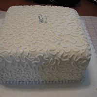 Bridal Shower This was for a bridal shower for a friend's sister. Fondant covered with cornelli lace. Pearl strand around the bottom.