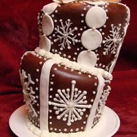Snowflake Topsy-Turvy My very first try at a topsy-turvy... I had trouble shaping the MMF but overall the process went pretty well. Chocolate cake, buttercream,...