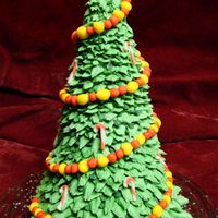 Christmas Tree Cake This is an almond apricot cake, with almond buttercream and marzipan filling. The branches/needles are buttercream and the decorations are...