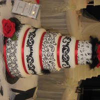 Black And White Five tier dummy wedding cake iced in Satin Ice fondant stencilled with black royal icing.Check out my website: illusionscakerentals.com