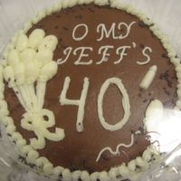 Jeff's 40 This was for an friend's grandson. She just wanted a small cake to take to him. 8" round, yellow cake with chocolate icing. Cream...