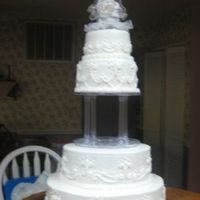 T & A Wedding 16, 12, 8, & 6 inch tiers. White cake w/ white icing. Scrollwork piped with #18 star tip, #21 tip shell borders, #5 dots.