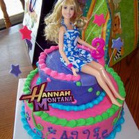 Allie's Hannah Montana Cake This cake was for my daughter's third birthday. She told me she wanted pink and a Hannah Montana barbie on top. I wanted it to look...