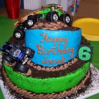 Jacob's Monster Jam Cake My first Topsy Turvy!! I was so happy that it didn't fall to pieces!! It was for my son's 6th birthday. He helped with the design...