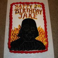 Darth Vadar The picture didn't turn out as well as the cake did. We tried to make the letters look as though they were on fire. Jake loved it....