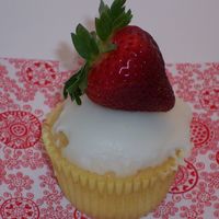 Vanilla Cupcake W/ Cream Cheese And Strawberry Filling, Topped With Lemon Glaze 
