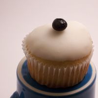Vanilla Cupcake W/ Cream Cheese And Blueberry, Topped With Lemon Glaze 