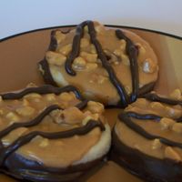 Pb Shorties Chocolate dipped Shortbread cookie w/ a peanut butter topping, swirled with melted chocolate on top