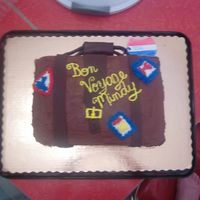 Suitcase Cake THis was done for a friend who was going a on a 1 month vacation in Europe. It is iced with choco. fudge frosting. I used chocolate fondant...