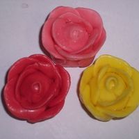 Starburstroses.jpg My first attempt at Starburst roses! I can't believe how easy they were. The first time I tried these with fondant they bombed, but...