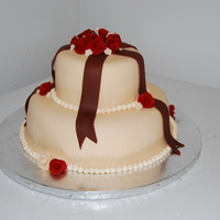 Ivory Cake With Brown Ribbon And Red/ivory Roses 