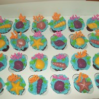 Sea Shell Cupcakes white cupcakes, bc icing,ri coral, chocolate sea shells