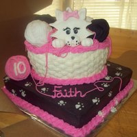 Kitty Cat basket is cake, iced in bc. fondant kitty and yarn