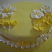 Yellow Flowers This was my first time doing flowers. And my first time using royal icing. It's vanilla with MMF.
