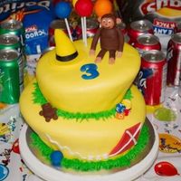 Curious George My first Topsy Turvy Cake and my first time doing fondant figures.