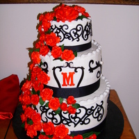 Red/black Theme Wedding Cake Roses are fondant, cake iced in BC, and I used the Cricut Cake for the black scroll work.