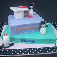 Graduation (With Penguins) I made this cake for a little girl graduating 5th grade. She loves penguins. Fondant Penguins, books covered in MMF.