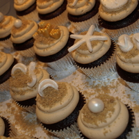 Beach Cupcakes Beach themed cupcakes for a bridal shower. Sandals, beach ball, bikini, star fish made out of MMF, sand dollars were MMF from a candy mold...