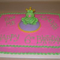 Kiss The Frog Prince Frog is made of fondant on top of fondant pillow, buttercream icing and trim.