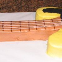 First Guitar This was lots of fun. The base of the cake was carved out of an 11x15. An 8x8 made the rest. Thanks for looking