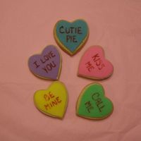Conversation Hearts NFSC with marshmallow rolled buttercream. These are small cookies packaged together. Made to look like the popular little candies.