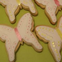 Butterflies For Mothers Day NFSC covered in marshmallow rolled buttercream. I used a crimper on the sides to get the "quilted" look. Painted with luster dust...