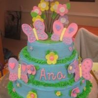 Butterfly And Flowers 6, 8, 10 yellow cake with BC icing. The butterflies and flowers are 50/50 gumpaste and MMF