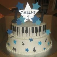 Music, 1St Birthday 8 inch yellow and 10 inch chocolate cake all done in BC with accent stars and music notes on top done in gumpaste thanks for looking the...