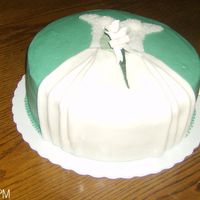 Shower Cake Dress White cake covered in Jade fondant, with Bride dress. Loved doing this cake was a lot of fun.