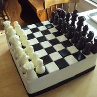 Chess Board Cake Made this for my friend's daughter. She is in 3rd grade and playing in the state chess tourney on her birthday. Her mom surprised her...