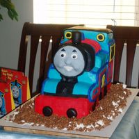 Thomas The Train Thomas the Train Cake for my Son's 3rd Birthday. Cake is White Chocolate with white chocolate creamcheese frosting.