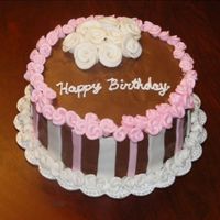 Duff Rose Birthday Triple chocolate cake with raspberry mousse filling and sour cream chocolate frosting. Fondant stripes and duff roses